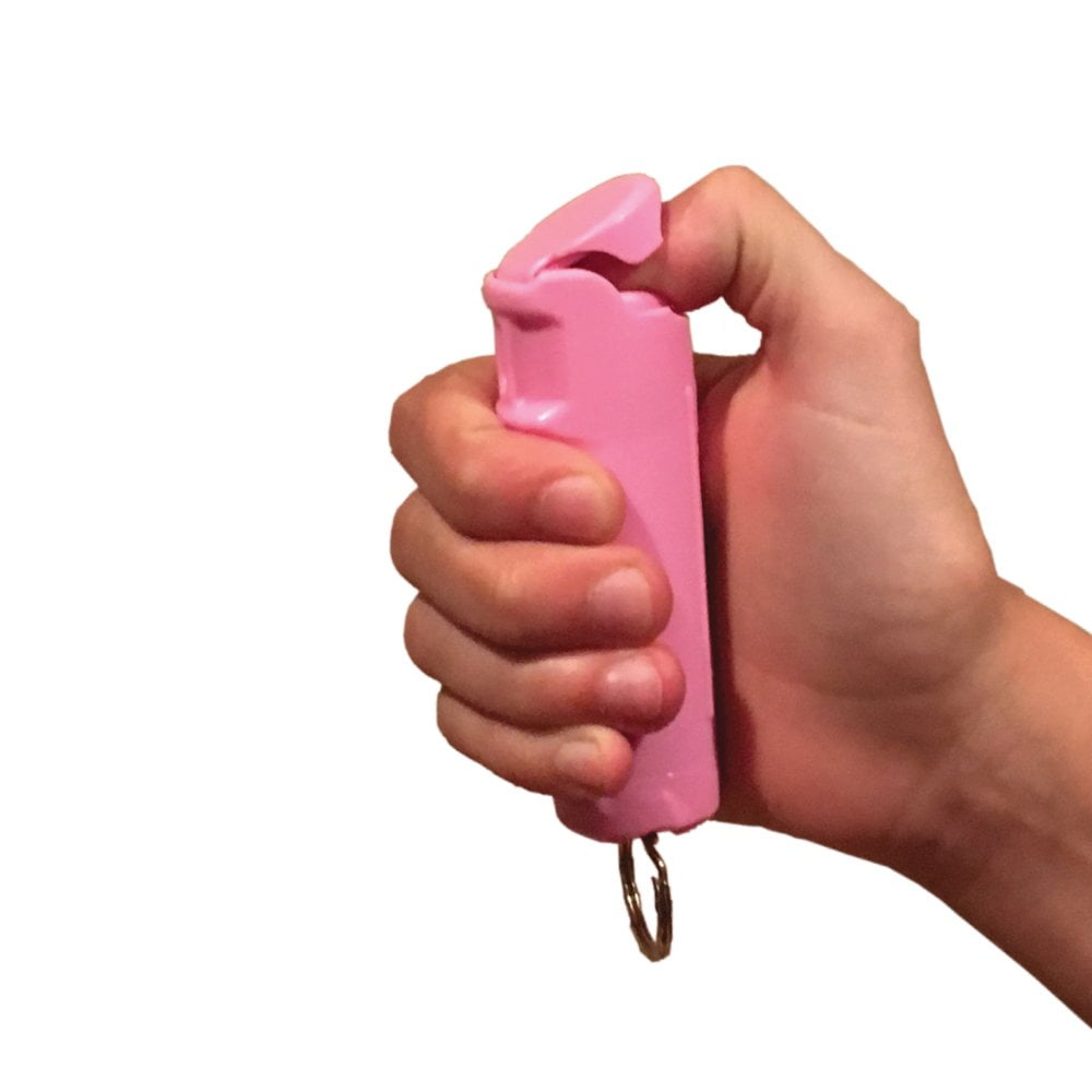 Police Force 23 Pepper Spray Flip Top 1/2 oz. Pink in hand