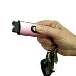 Streetwise 22M USB Secure Keychain Stun Gun - pink in hand w/ light on