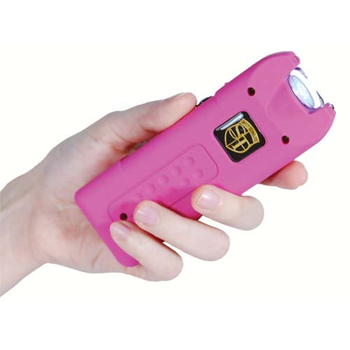 MultiGuard Stun Gun Pink in hand flashlight beam