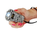 Trigger Stun Gun Flashlight Zebra in hand